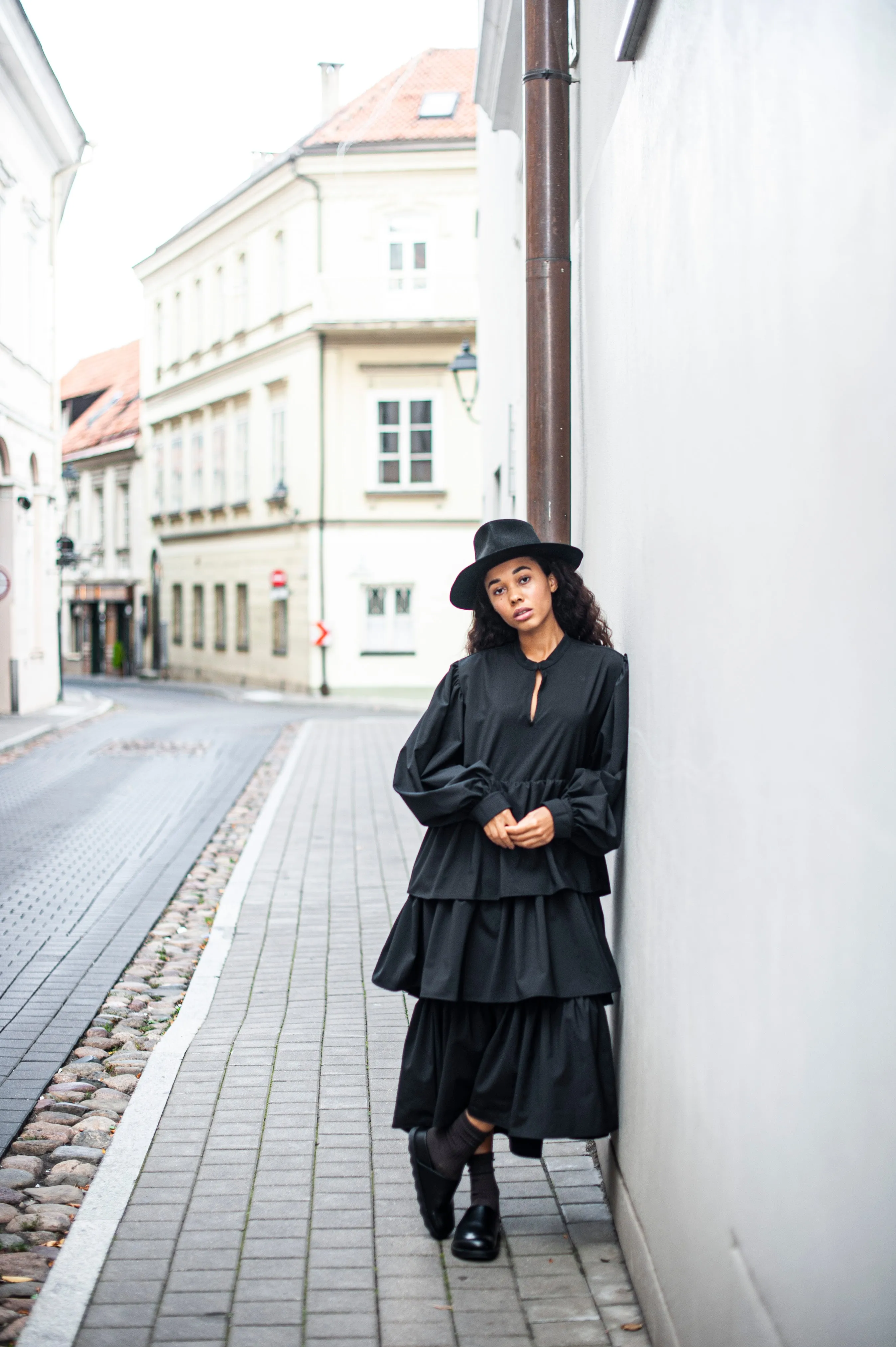 Black maxi wool dress with puff sleeves and ruffles