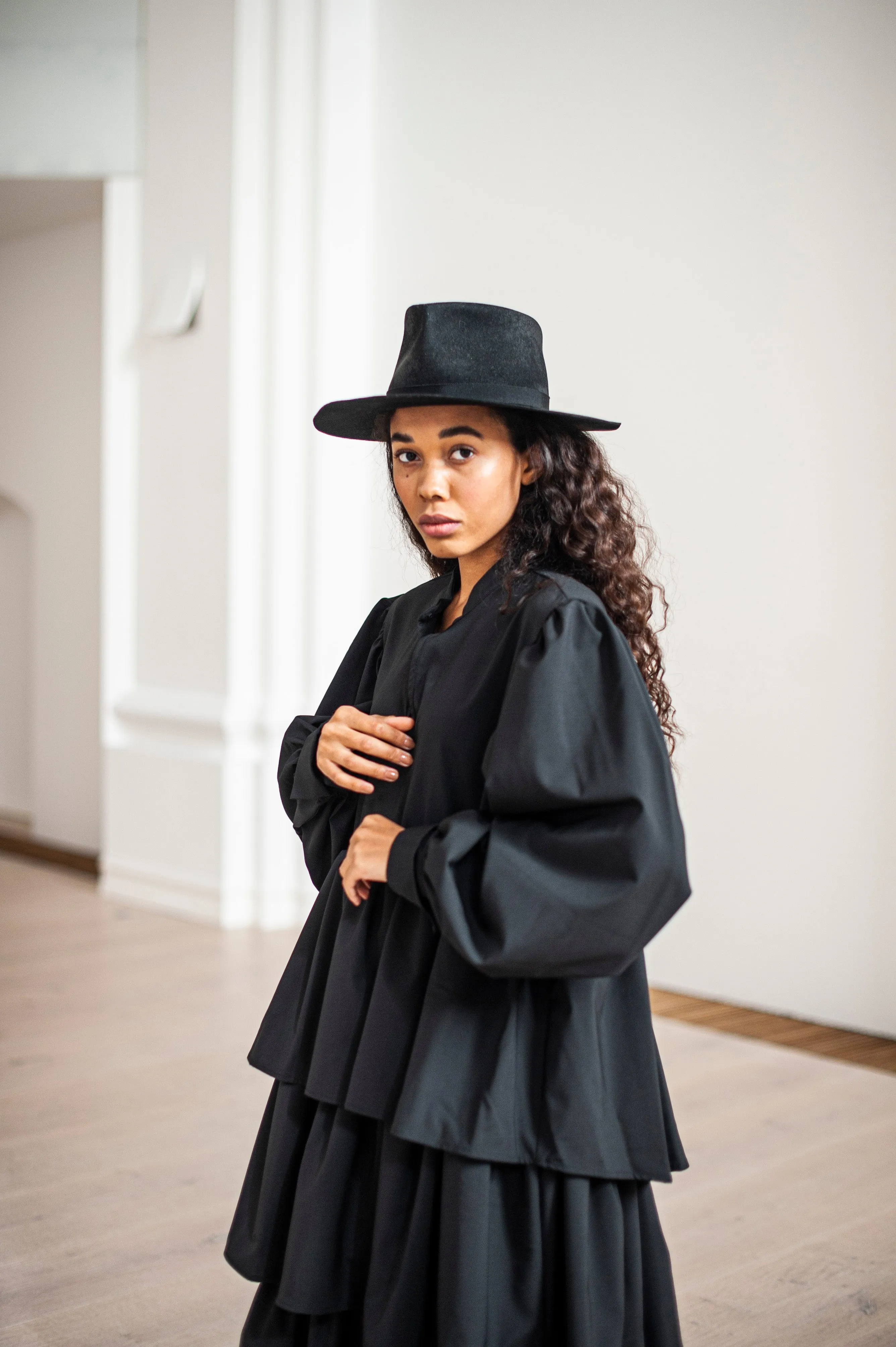Black maxi wool dress with puff sleeves and ruffles