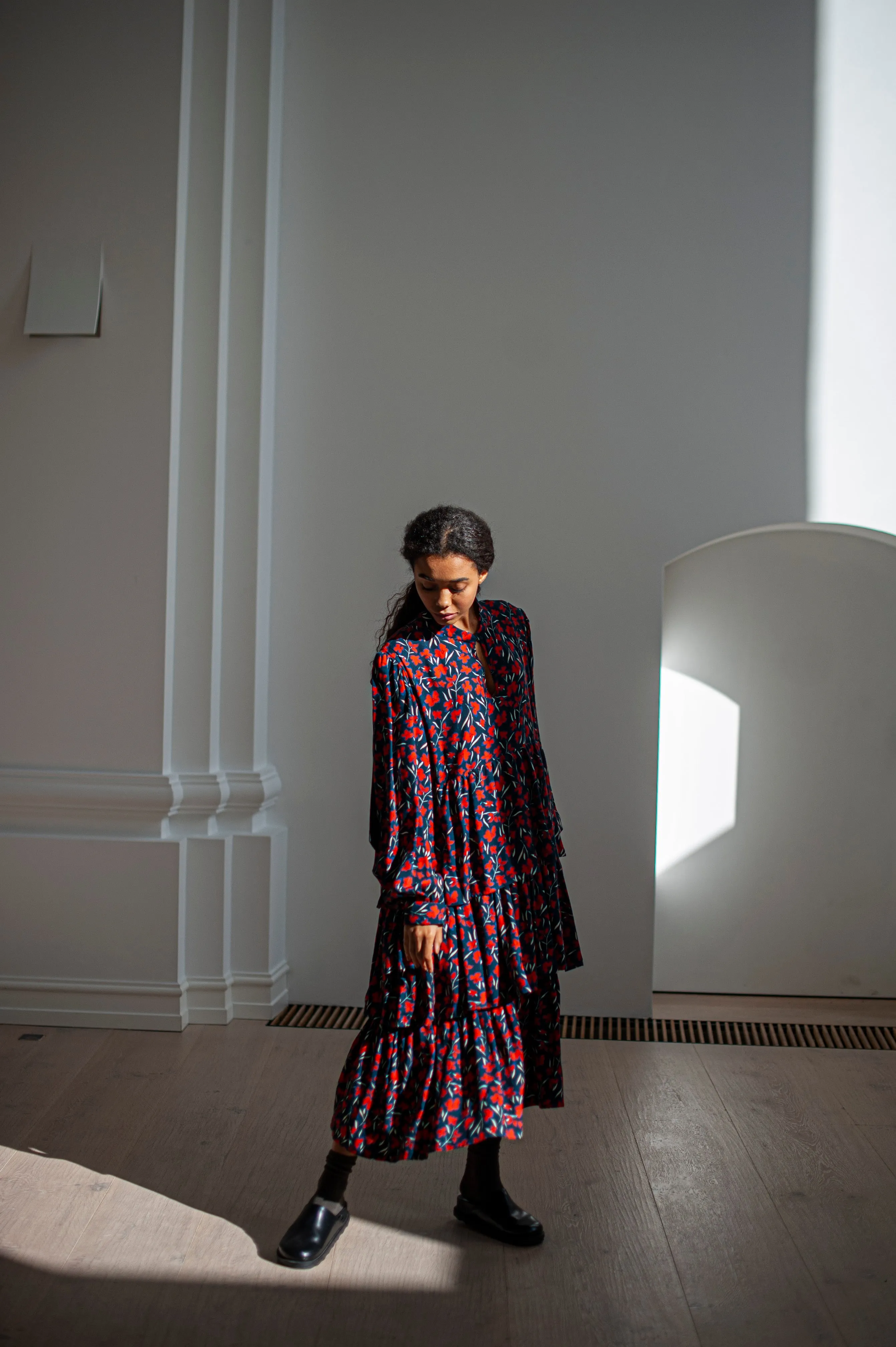 Black maxi wool dress with puff sleeves and ruffles