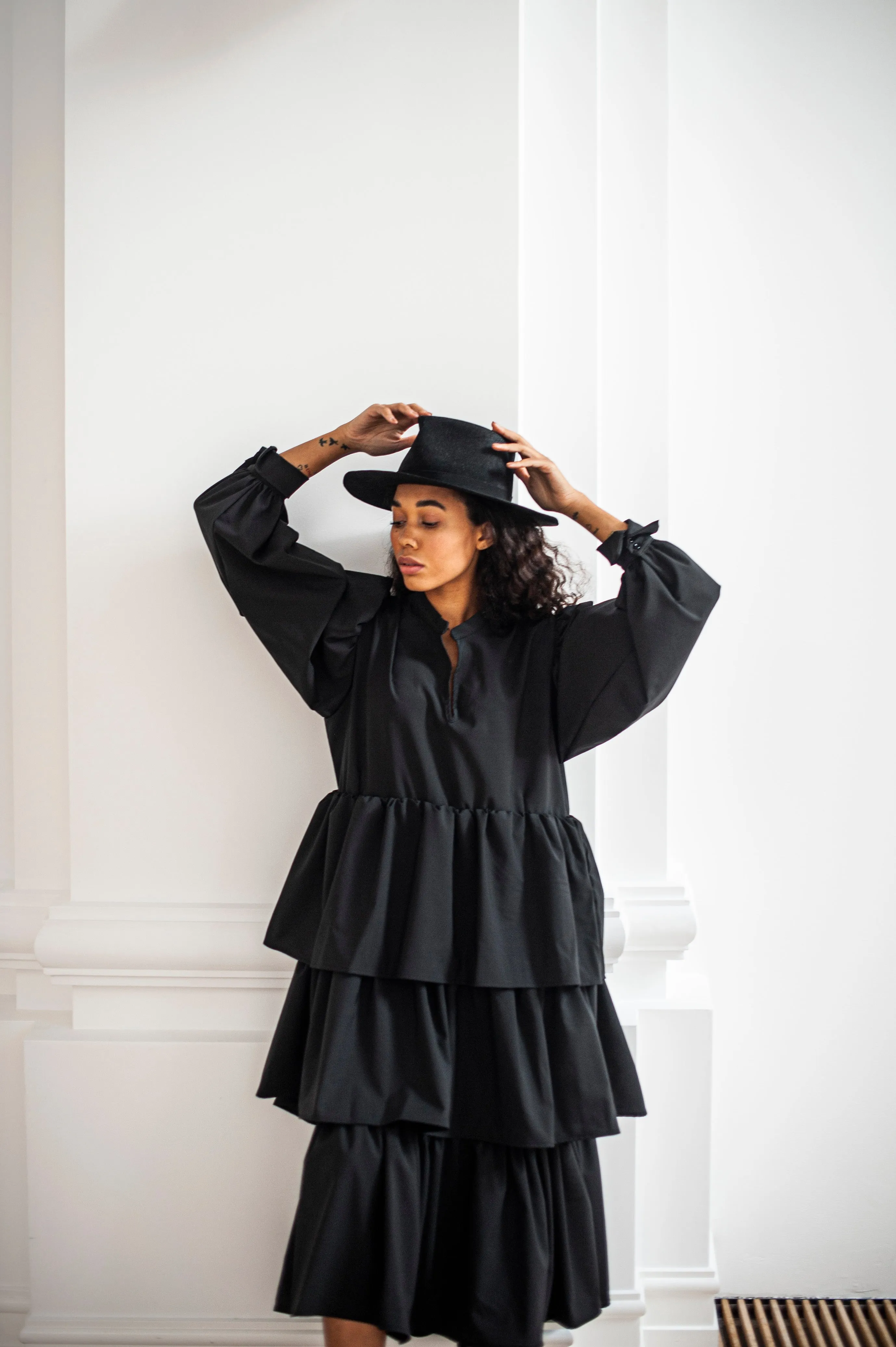 Black maxi wool dress with puff sleeves and ruffles