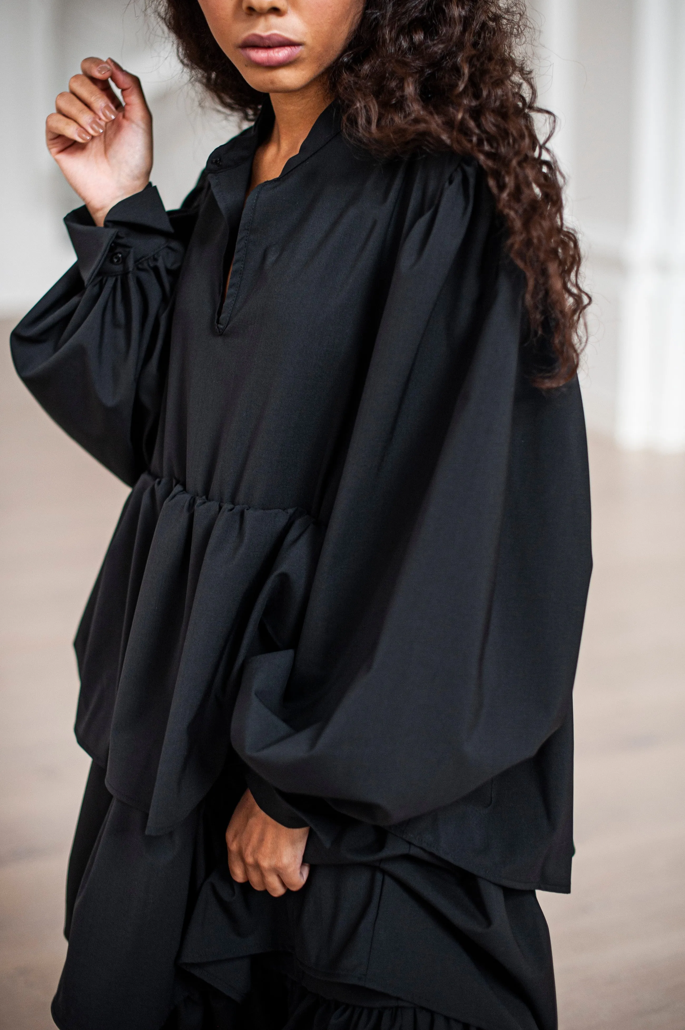 Black maxi wool dress with puff sleeves and ruffles
